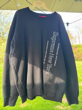 Supreme Black Crewneck Sweatshirt with Vertical White 'Supreme New York' Logo